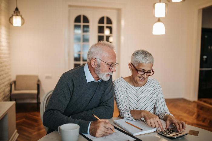 An elderly couple planning their retirement
